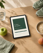 Tablet con la portada de la guía Tu Plan de Cambio sobre una mesa de madera